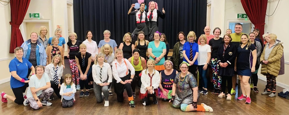 group of people who took part in the swoovathon dressed in school uniform